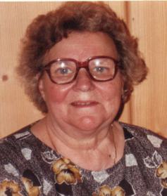 Porträt einer älteren Frau mit Brille.